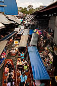 Thailand, Locals sell fruits, food and products at Damnoen Saduak floating market near Bangkok 